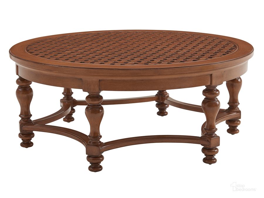 The appearance of Harbor Isle Round Cocktail Table designed by Tommy Bahama in the transitional interior design. This walnut piece of furniture  was selected by 1StopBedrooms from Harbor Collection to add a touch of cosiness and style into your home. Sku: 01-3935-947. Product Type: Cocktail Table. Image1