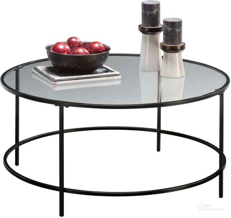 The appearance of Harvey Park Round Coffee Table In Black designed by Sauder in the modern / contemporary interior design. This black piece of furniture  was selected by 1StopBedrooms from Harvey Park Collection to add a touch of cosiness and style into your home. Sku: 414970. Material: Metal. Product Type: Coffee Table. Image1