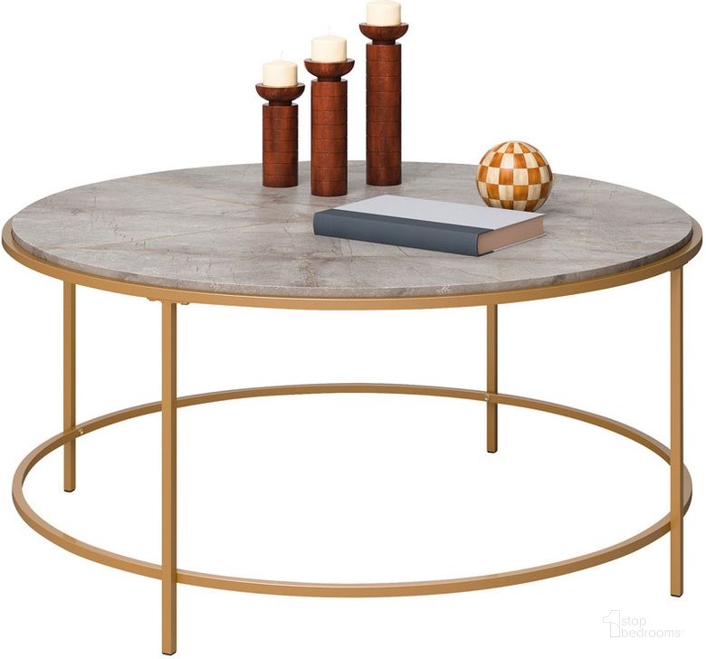 The appearance of International Lux Round Coffee Table In Deco Stone designed by Sauder in the transitional interior design. This deco stone piece of furniture  was selected by 1StopBedrooms from International Lux Collection to add a touch of cosiness and style into your home. Sku: 428215. Product Type: Coffee Table. Material: Engineered Wood. Image1