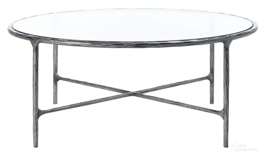 The appearance of Jessa Round Metal Coffee Table In Silver designed by Safavieh Couture in the glam interior design. This silver piece of furniture  was selected by 1StopBedrooms from Jessa Collection to add a touch of cosiness and style into your home. Sku: SFV9501B. Material: Metal. Product Type: Coffee Table. Image1