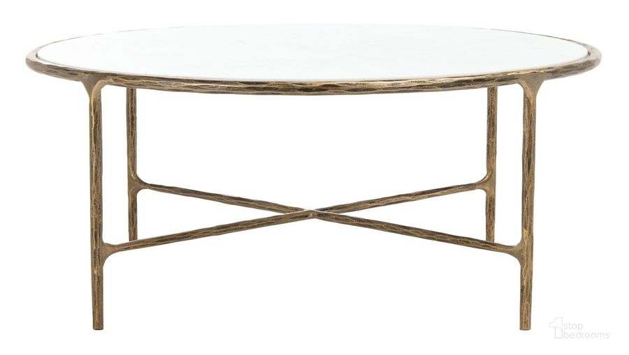 The appearance of Jessa Round Metal Coffee Table In White And Brass designed by Safavieh Couture in the glam interior design. This white and brushed brass piece of furniture  was selected by 1StopBedrooms from Jessa Collection to add a touch of cosiness and style into your home. Sku: SFV9501C. Material: Metal. Product Type: Coffee Table. Image1