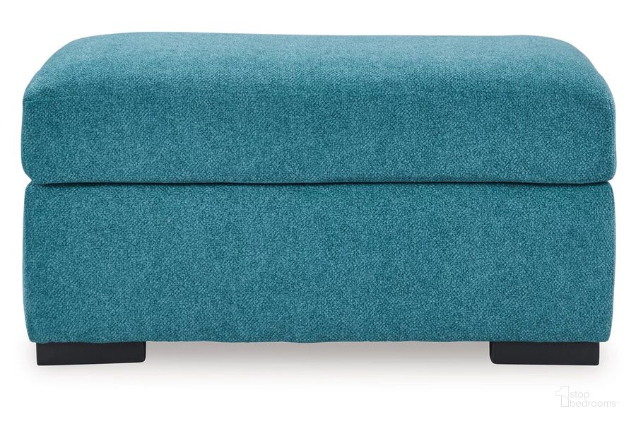 The appearance of Keerwick Ottoman In Teal designed by Signature Design by Ashley in the modern / contemporary interior design. This teal piece of furniture  was selected by 1StopBedrooms from Keerwick Collection to add a touch of cosiness and style into your home. Sku: 6750714. Material: Fabric. Product Type: Ottoman. Image1