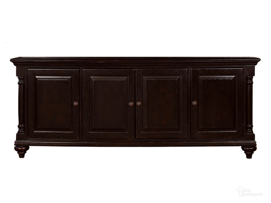 The appearance of Kingstown Rich Tamarind Wellington Media Console designed by Tommy Bahama in the traditional interior design. This brown piece of furniture  was selected by 1StopBedrooms from Kingstown Collection to add a touch of cosiness and style into your home. Sku: 01-0619-908. Material: Leather. Product Type: Media Console. Image1