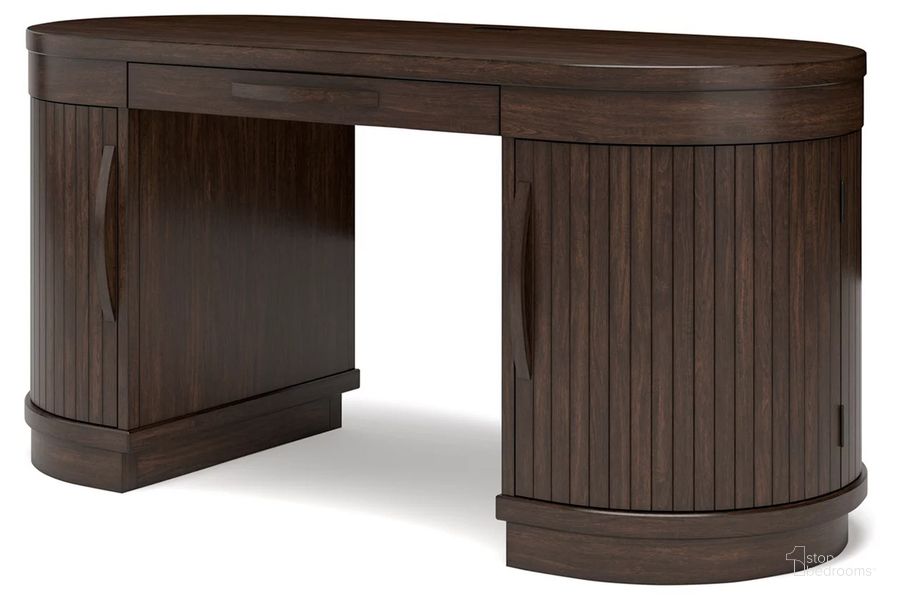 The appearance of Korestone 63 Inch Home Office Desk In Warm Brown designed by Signature Design by Ashley in the modern / contemporary interior design. This warm brown piece of furniture  was selected by 1StopBedrooms from Korestone Collection to add a touch of cosiness and style into your home. Sku: H687-27. Material: Wood. Product Type: Home Office Desk. Image1