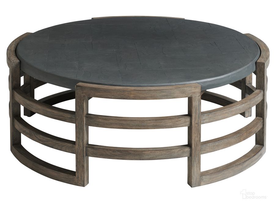 The appearance of La Jolla Round Cocktail Table designed by Tommy Bahama in the modern / contemporary interior design. This taupe piece of furniture  was selected by 1StopBedrooms from La Jolla Collection to add a touch of cosiness and style into your home. Sku: 01-3950-947. Material: Wood. Product Type: Cocktail Table. Image1