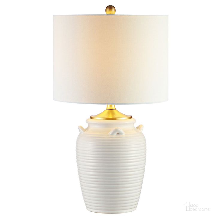 The appearance of Lener Table Lamp in Ivory designed by Safavieh in the modern / contemporary interior design. This ivory piece of furniture  was selected by 1StopBedrooms from Lener Collection to add a touch of cosiness and style into your home. Sku: TBL4243A. Material: Ceramic. Product Type: Table Lamp. Image1