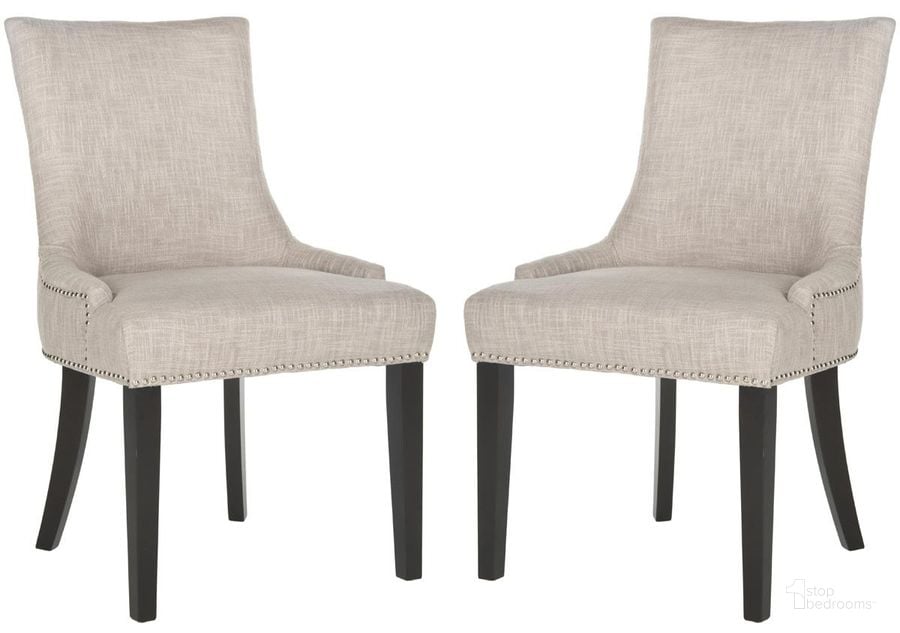 The appearance of Lester Grey Dining Chair with Silver Nailhead Detail Set of 2 designed by Safavieh in the transitional interior design. This grey piece of furniture  was selected by 1StopBedrooms from Dariela Collection to add a touch of cosiness and style into your home. Sku: MCR4709AG-SET2. Product Type: Dining Chair. Material: Stainless Steel. Image1