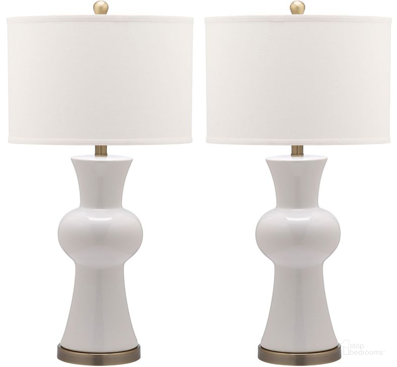 The appearance of Lola 29 Inch White Ceramic and Iron Table Lamp Set of 2 with Usb Port designed by Safavieh in the modern / contemporary interior design. This white piece of furniture  was selected by 1StopBedrooms from Lola Collection to add a touch of cosiness and style into your home. Sku: LIT4150B-SET2-U. Material: Ceramic. Product Type: Table Lamp. Image1