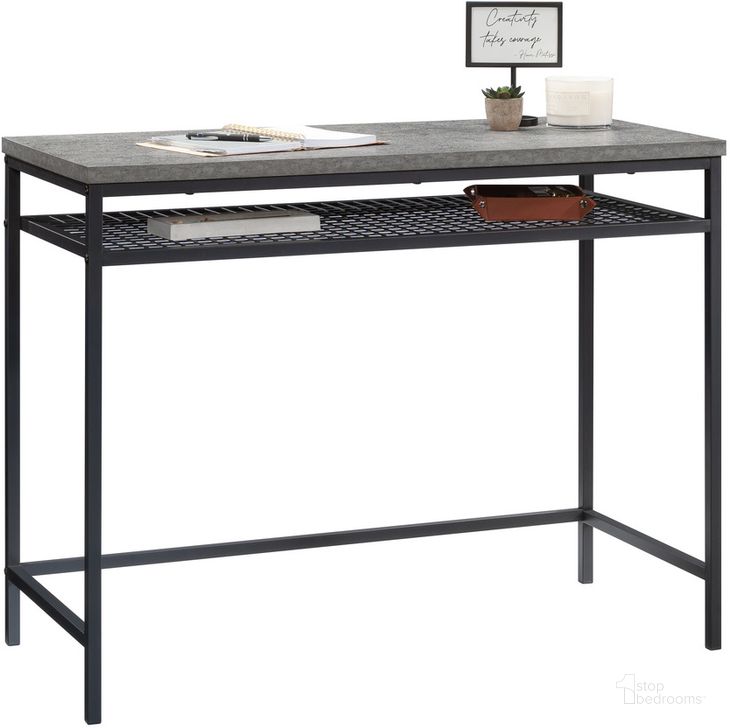 The appearance of Market Commons Writing Desk In Slate Gray designed by Sauder in the transitional interior design. This slate gray piece of furniture  was selected by 1StopBedrooms from Market Commons Collection to add a touch of cosiness and style into your home. Sku: 431311. Product Type: Writing Desk. Material: Engineered Wood. Image1