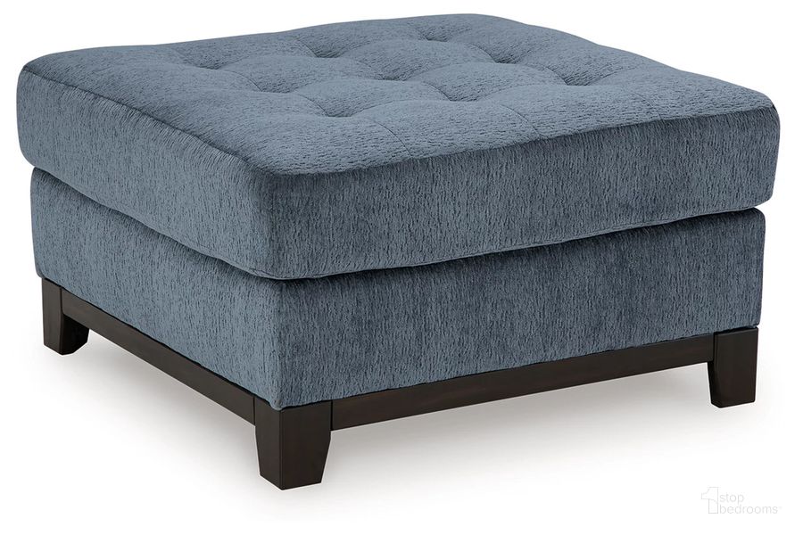 The appearance of Maxon Place Oversized Accent Ottoman In Navy designed by Signature Design by Ashley in the modern / contemporary interior design. This navy piece of furniture  was selected by 1StopBedrooms from Maxon Place Collection to add a touch of cosiness and style into your home. Sku: 3300308. Material: Fabric. Product Type: Ottoman. Image1