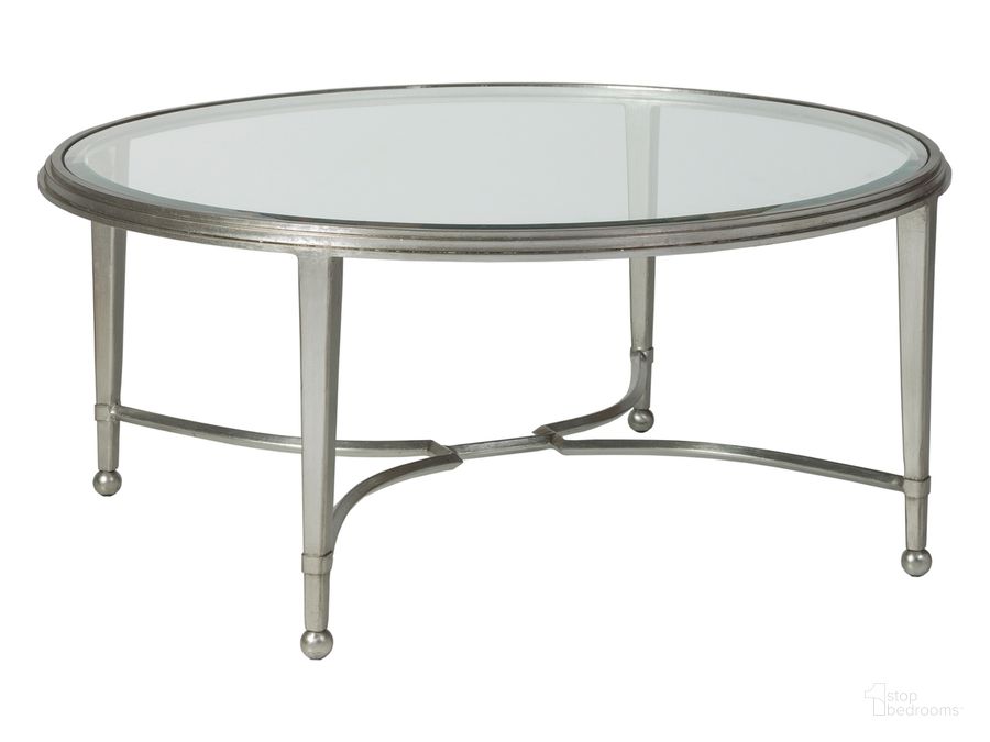 The appearance of Metal Designs Sangiovese Round Cocktail Table 01-2011-943-47 designed by Artistica Home in the transitional interior design. This silver piece of furniture  was selected by 1StopBedrooms from Metal Designs Collection to add a touch of cosiness and style into your home. Sku: 01-2011-943-47. Product Type: Cocktail Table. Image1