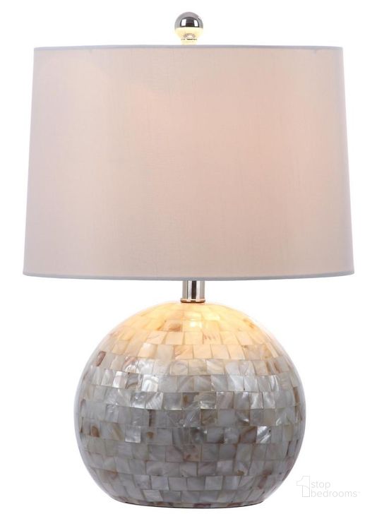 The appearance of Nikki White 21 Inch Shell Table Lamp designed by Safavieh in the modern / contemporary interior design. This white piece of furniture  was selected by 1StopBedrooms from Nikki Collection to add a touch of cosiness and style into your home. Sku: LITS4109B. Product Type: Table Lamp. Image1