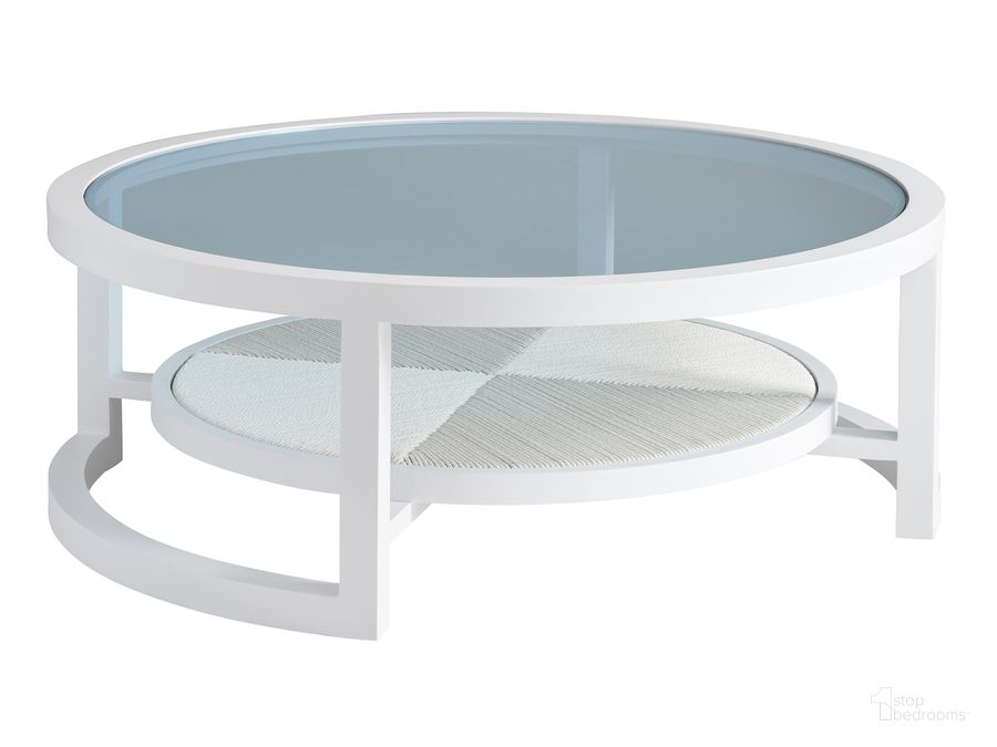 The appearance of Ocean Breeze Promenade Round Cocktail Table designed by Tommy Bahama in the coastal interior design. This white piece of furniture  was selected by 1StopBedrooms from Ocean Breeze Promenade Collection to add a touch of cosiness and style into your home. Sku: 01-3460-943. Product Type: Outdoor Table. Image1