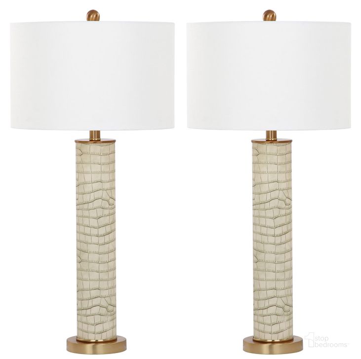 The appearance of Ollie Cream Faux Snakeskin 31.5 Inch Table Lamp Set of 2 designed by Safavieh in the traditional interior design. This cream piece of furniture  was selected by 1StopBedrooms from Ollie Collection to add a touch of cosiness and style into your home. Sku: LIT4404C-SET2. Product Type: Table Lamp. Image1