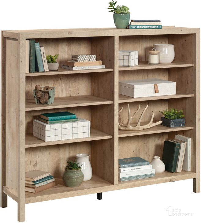 The appearance of Pacific View Bookcase In Prime Oak designed by Sauder in the transitional interior design. This prime oak piece of furniture  was selected by 1StopBedrooms from Pacific View Collection to add a touch of cosiness and style into your home. Sku: 433566. Product Type: Bookcase. Material: Engineered Wood. Image1
