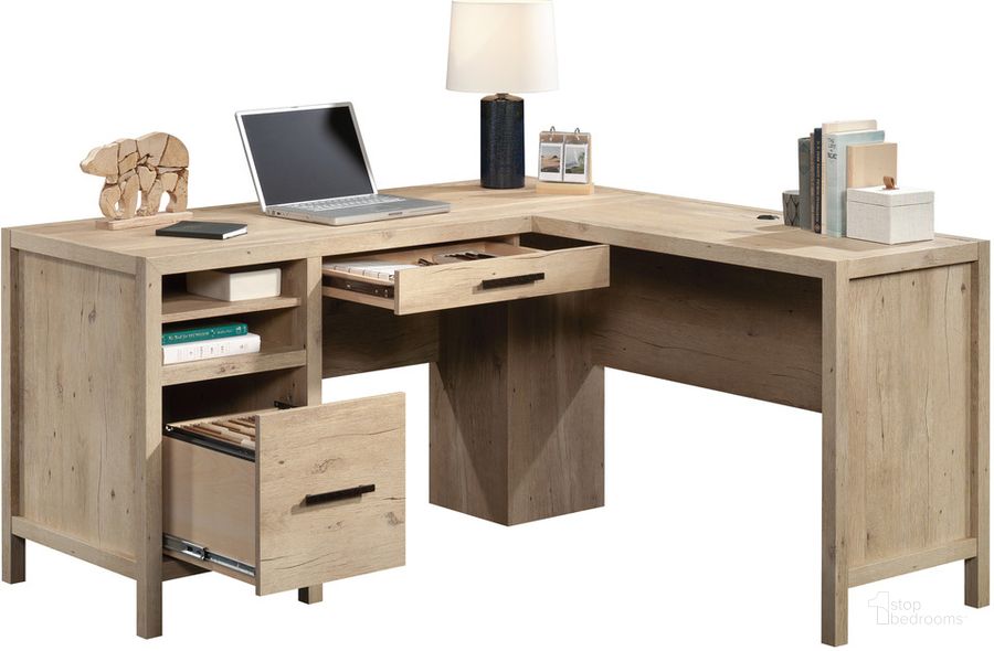 The appearance of Pacific View L-Shaped Desk In Prime Oak designed by Sauder in the transitional interior design. This prime oak piece of furniture  was selected by 1StopBedrooms from Pacific View Collection to add a touch of cosiness and style into your home. Sku: 433562. Product Type: Desk. Material: Engineered Wood. Image1