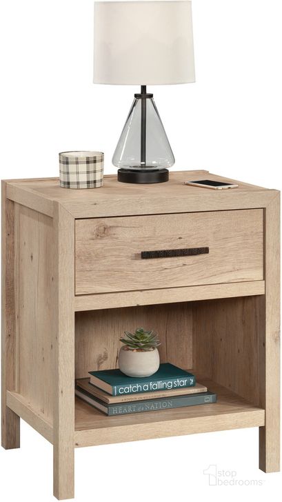 The appearance of Pacific View Night Stand In Prime Oak designed by Sauder in the transitional interior design. This prime oak piece of furniture  was selected by 1StopBedrooms from Pacific View Collection to add a touch of cosiness and style into your home. Sku: 433565. Product Type: Nightstand. Material: Engineered Wood. Image1