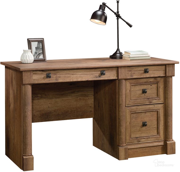 The appearance of Palladia Computer Desk In Vintage Oak designed by Sauder in the traditional interior design. This vintage oak piece of furniture  was selected by 1StopBedrooms from Palladia Collection to add a touch of cosiness and style into your home. Sku: 422002. Product Type: Computer Desk. Material: Engineered Wood. Image1
