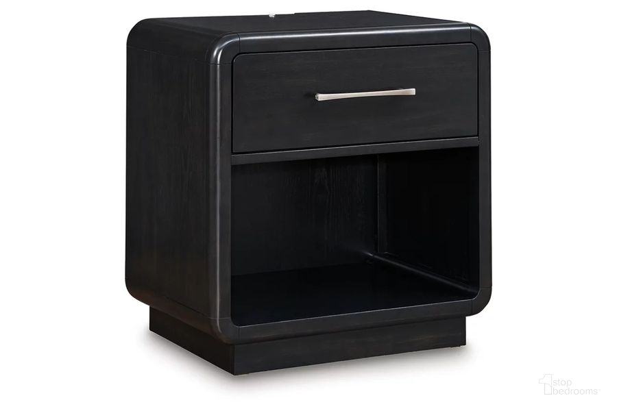 The appearance of Rowanbeck Nightstand In Black designed by Signature Design by Ashley in the modern / contemporary interior design. This black piece of furniture  was selected by 1StopBedrooms from Rowanbeck Collection to add a touch of cosiness and style into your home. Sku: B821-91. Material: Wood. Product Type: Nightstand. Image1