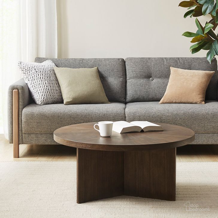 The appearance of Sadie Round Coffee Table In Brown designed by Olliix in the modern / contemporary interior design. This brown piece of furniture  was selected by 1StopBedrooms from Sadie Collection to add a touch of cosiness and style into your home. Sku: MT120-0150. Product Type: Coffee Table. Material: Wood Veneer. Image1
