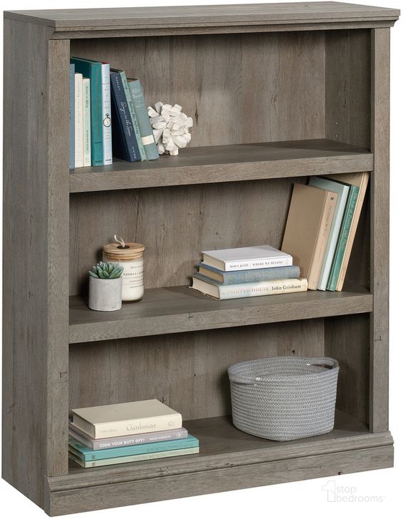 The appearance of Sauder Select 3-Shelf Bookcase In Mystic Oak designed by Sauder in the transitional interior design. This mystic oak piece of furniture  was selected by 1StopBedrooms from Sauder Select Collection to add a touch of cosiness and style into your home. Sku: 426426. Product Type: Bookcase. Material: Engineered Wood. Image1