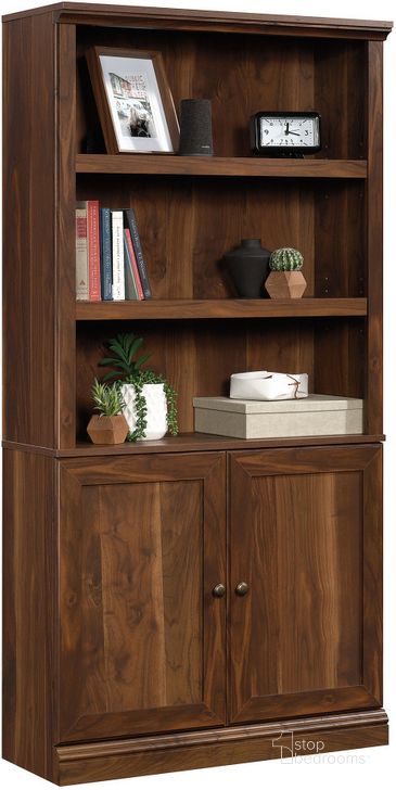 The appearance of Sauder Select Bookcase With Doors In Grand Walnut designed by Sauder in the transitional interior design. This grand walnut piece of furniture  was selected by 1StopBedrooms from Sauder Select Collection to add a touch of cosiness and style into your home. Sku: 426419. Product Type: Bookcase. Material: Engineered Wood. Image1