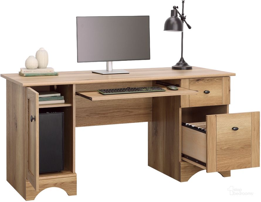 The appearance of Sauder Select Computer Desk In Timber Oak designed by Sauder in the transitional interior design. This timber oak piece of furniture  was selected by 1StopBedrooms from Sauder Select Collection to add a touch of cosiness and style into your home. Sku: 433952. Product Type: Computer Desk. Material: Engineered Wood. Image1