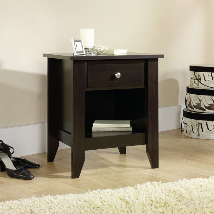 The appearance of Shoal Creek Night Stand In Jamocha Wood designed by Sauder in the transitional interior design. This jamocha wood piece of furniture  was selected by 1StopBedrooms from Shoal Creek Collection to add a touch of cosiness and style into your home. Sku: 409942. Product Type: Nightstand. Material: Engineered Wood. Image1