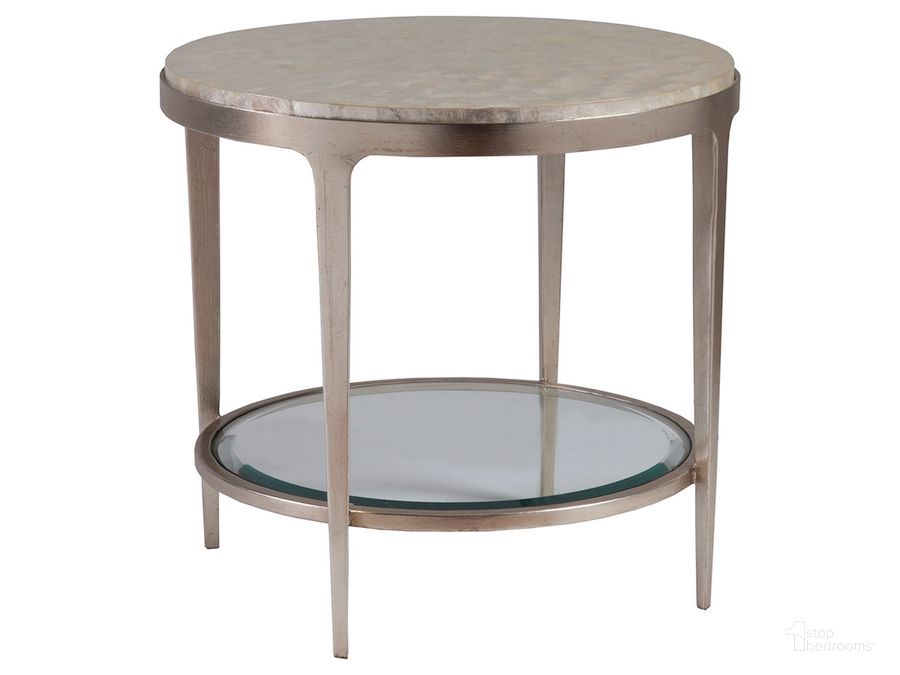 The appearance of Signature Designs Champagne Foil Gravitas Round End Table designed by Artistica Home in the transitional interior design. This gray piece of furniture  was selected by 1StopBedrooms from Signature Designs Collection to add a touch of cosiness and style into your home. Sku: 01-2050-953C. Product Type: End Table.