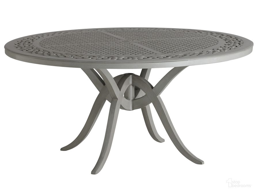 The appearance of Silver Sands Round Dining Table designed by Tommy Bahama in the transitional interior design. This silver piece of furniture  was selected by 1StopBedrooms from Silver Sands Collection to add a touch of cosiness and style into your home. Sku: 01-3945-875C. Table Base Style: Trestle. Table Top Shape: Round. Material: Aluminum. Product Type: Dining Table. Size: 60". Image1