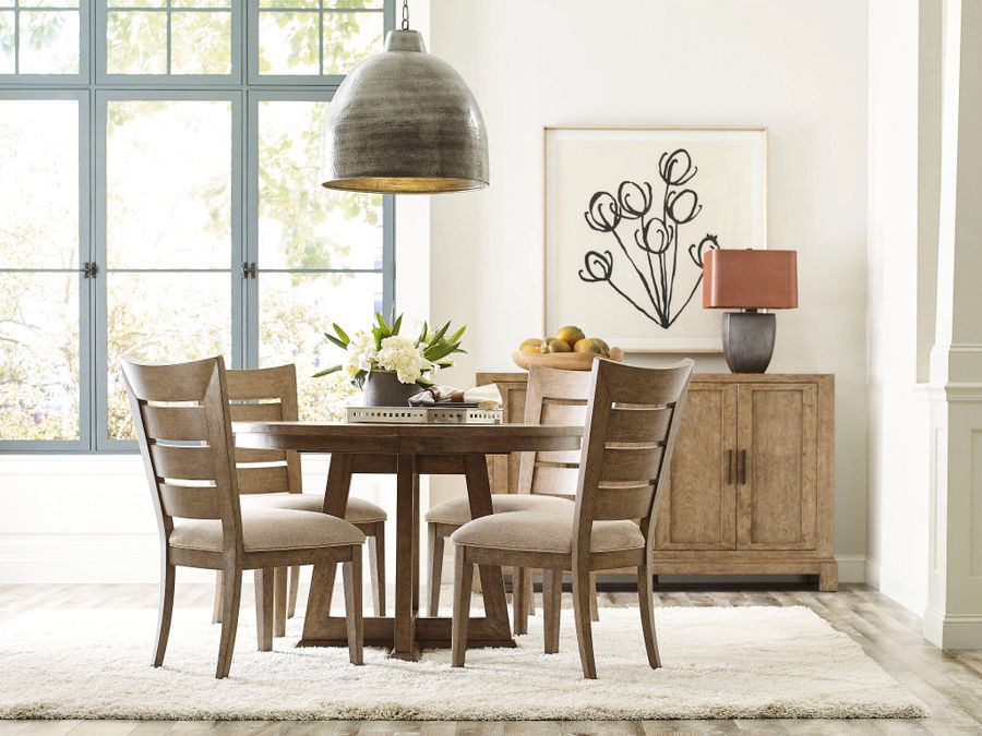 The appearance of Skyline Smoke Knox Extendable Round Dining Room Set designed by American Drew in the transitional interior design. This brown piece of furniture  was selected by 1StopBedrooms from Skyline Collection to add a touch of cosiness and style into your home. Sku: 010-701;010-636. Material: Wood. Product Type: Dining Room Set. Image1
