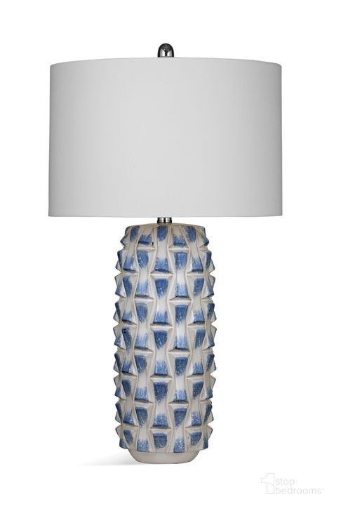 The appearance of Stones Table Lamp In Blue and White designed by Bassett Mirror Company in the modern / contemporary interior design. This blue/white piece of furniture  was selected by 1StopBedrooms from  to add a touch of cosiness and style into your home. Sku: L4295T. Material: Ceramic. Product Type: Table Lamp. Image1