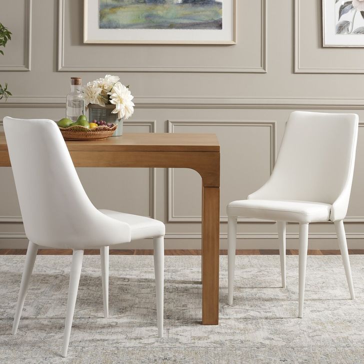 The appearance of Summerset White Leather Side Chair Set of 2 designed by Safavieh in the traditional interior design. This white piece of furniture  was selected by 1StopBedrooms from Leilani Collection to add a touch of cosiness and style into your home. Sku: FOX2014A-SET2. Product Type: Dining Chair. Material: Iron. Image1