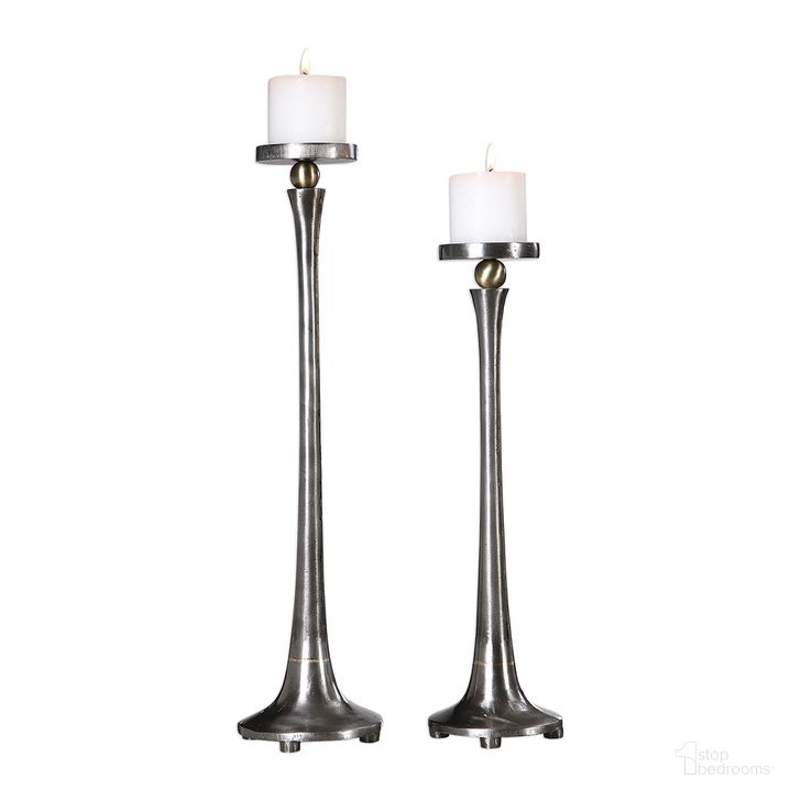 The appearance of Uttermost Aliso Cast Iron Candleholders Set Of 2 designed by Uttermost in the modern / contemporary interior design. This nickel piece of furniture  was selected by 1StopBedrooms from Aliso Collection to add a touch of cosiness and style into your home. Sku: 18994. Product Type: Candle Holder. Material: Iron. Image1