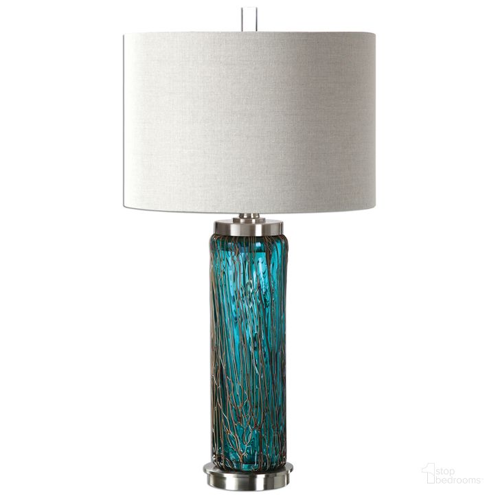 The appearance of Uttermost Almanzora Blue Glass Lamp designed by Uttermost in the modern / contemporary interior design. This blue piece of furniture  was selected by 1StopBedrooms from Almanzora Collection to add a touch of cosiness and style into your home. Sku: 27087-1. Material: Metal. Product Type: Lamp. Image1