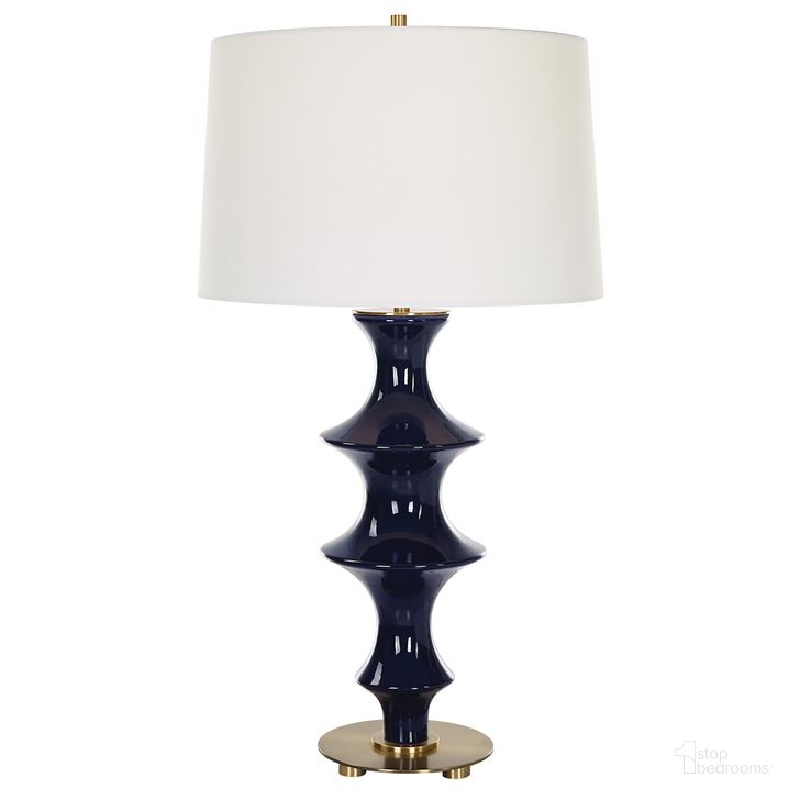 The appearance of Uttermost Coil Sculpted Blue Table Lamp designed by Uttermost in the modern / contemporary interior design. This blue piece of furniture  was selected by 1StopBedrooms from Coil Collection to add a touch of cosiness and style into your home. Sku: 30196. Material: Ceramic. Product Type: Table Lamp. Image1