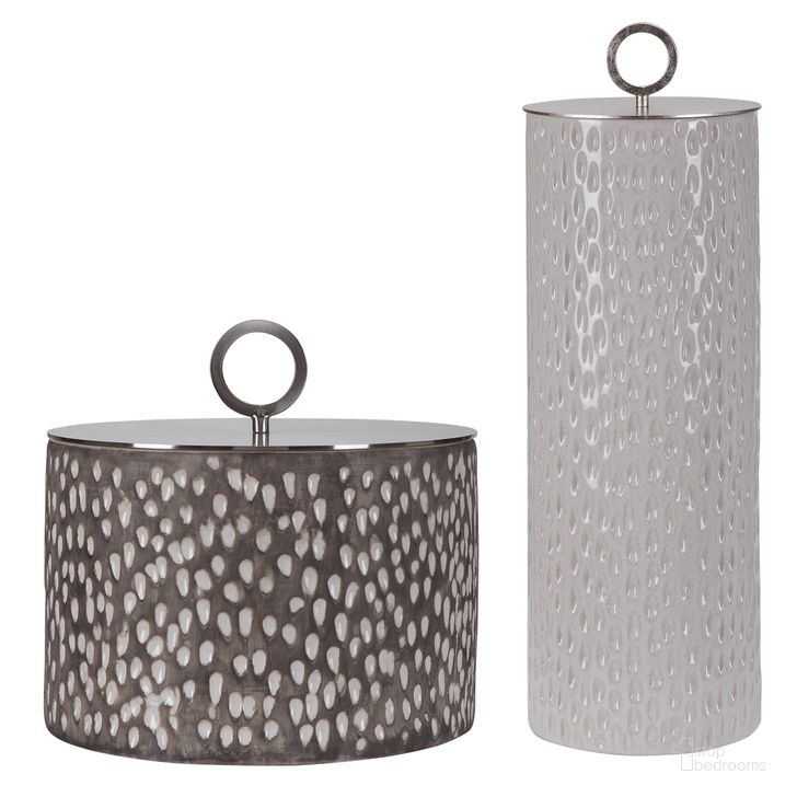 The appearance of Uttermost Cyprien Ceramic Containers Set Of 2 designed by Uttermost in the modern / contemporary interior design. This gold piece of furniture  was selected by 1StopBedrooms from Cyprien Collection to add a touch of cosiness and style into your home. Sku: 17766. Product Type: Decorative Accessory. Material: Stainless Steel. Image1