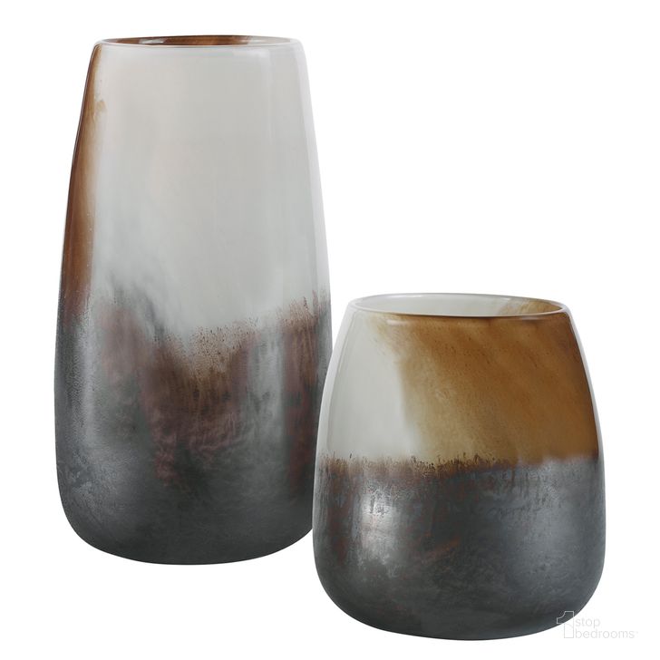 The appearance of Uttermost Desert Wind Glass Vases Set Of 2 designed by Uttermost in the modern / contemporary interior design. This bronze piece of furniture  was selected by 1StopBedrooms from Desert Wind Collection to add a touch of cosiness and style into your home. Sku: 18047. Material: Glass. Product Type: Decorative Accessory. Image1