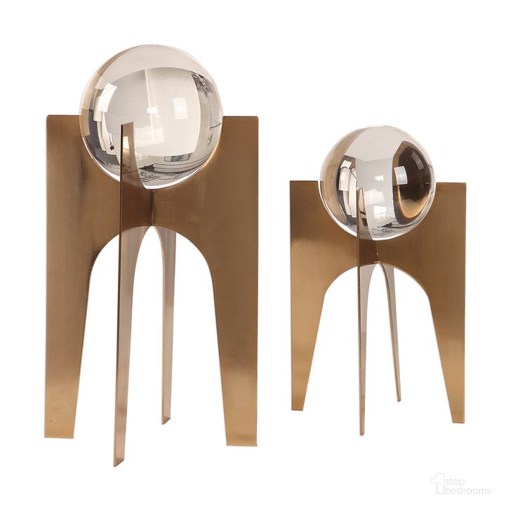 The appearance of Uttermost Ellianna Crystal Spheres Set Of 2 designed by Uttermost in the modern / contemporary interior design. This gold piece of furniture  was selected by 1StopBedrooms from Ellianna Collection to add a touch of cosiness and style into your home. Sku: 18574. Product Type: Decorative Accessory. Material: Stainless Steel. Image1