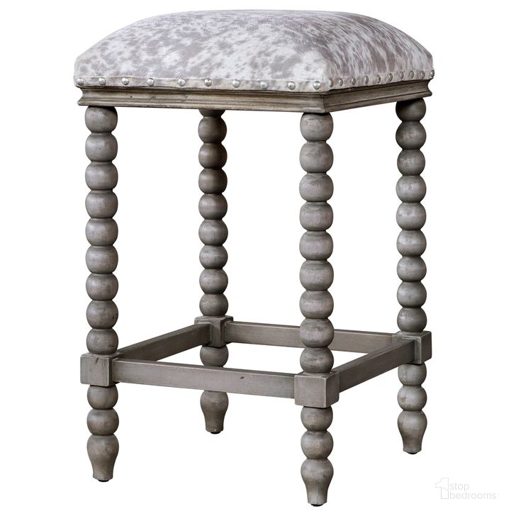 The appearance of Uttermost Estes Faux Cow Hide Counter Stool designed by Uttermost in the transitional interior design. This gray piece of furniture  was selected by 1StopBedrooms from Estes Collection to add a touch of cosiness and style into your home. Sku: 23569. Material: Wood. Product Type: Barstool. Image1