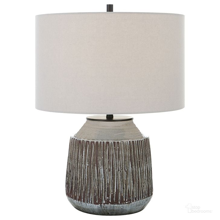 The appearance of Uttermost Neolithic Blue-Gray Table Lamp designed by Uttermost in the modern / contemporary interior design. This blue and grey piece of furniture  was selected by 1StopBedrooms from Neolithic Collection to add a touch of cosiness and style into your home. Sku: 30062-1. Material: Steel. Product Type: Table Lamp. Image1