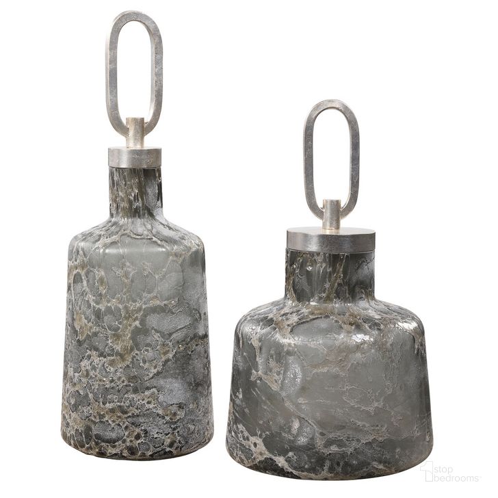 The appearance of Uttermost Storm Art Glass Bottles Set Of 2 designed by Uttermost in the modern / contemporary interior design. This black piece of furniture  was selected by 1StopBedrooms from Storm Collection to add a touch of cosiness and style into your home. Sku: 17840. Product Type: Decorative Accessory. Material: Iron. Image1