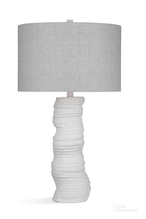 The appearance of Veers Table Lamp In Matte White designed by Bassett Mirror Company in the modern / contemporary interior design. This white piece of furniture  was selected by 1StopBedrooms from  to add a touch of cosiness and style into your home. Sku: L4259T. Material: Resin. Product Type: Table Lamp. Image1