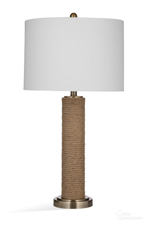 The appearance of Welch Table Lamp In Natural Linen and Antique Brass designed by Bassett Mirror Company in the coastal interior design. This natural piece of furniture  was selected by 1StopBedrooms from  to add a touch of cosiness and style into your home. Sku: L4239T. Material: Metal. Product Type: Table Lamp. Image1