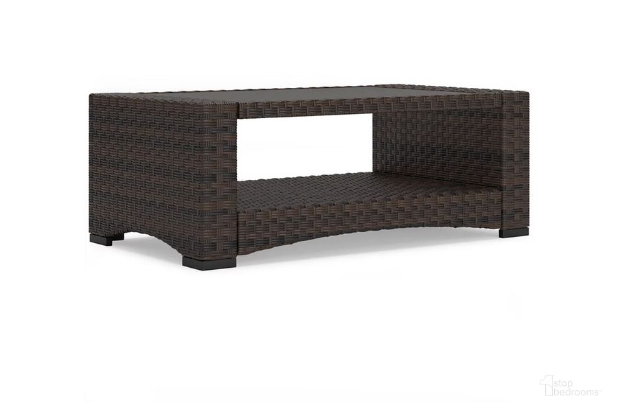 The appearance of Windglow Outdoor Coffee Table In Brown designed by Signature Design by Ashley in the transitional interior design. This brown piece of furniture  was selected by 1StopBedrooms from Windglow Collection to add a touch of cosiness and style into your home. Sku: P340-701. Product Type: Outdoor Table. Material: Resin. Image1