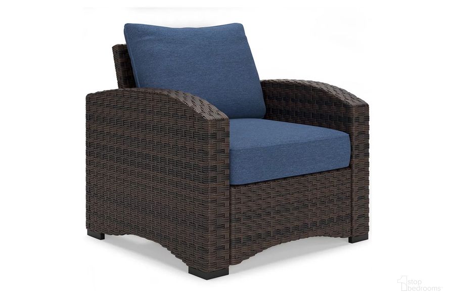 The appearance of Windglow Outdoor Lounge Chair with Cushion In Blue/Brown designed by Signature Design by Ashley in the transitional interior design. This blue/brown piece of furniture  was selected by 1StopBedrooms from Windglow Collection to add a touch of cosiness and style into your home. Sku: P340-820. Material: Aluminum. Product Type: Outdoor Lounge Chair. Image1