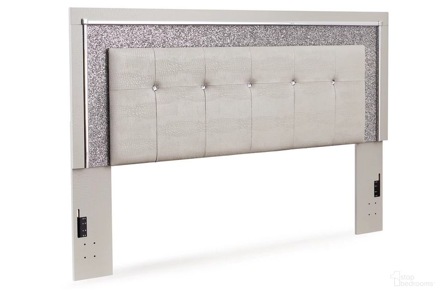 The appearance of Zyniden King Upholstered Panel Headboard In Silver designed by Signature Design by Ashley in the modern / contemporary interior design. This silver piece of furniture  was selected by 1StopBedrooms from Zyniden Collection to add a touch of cosiness and style into your home. Sku: B2114-58. Product Type: Headboard. Material: Leather Match. Image1
