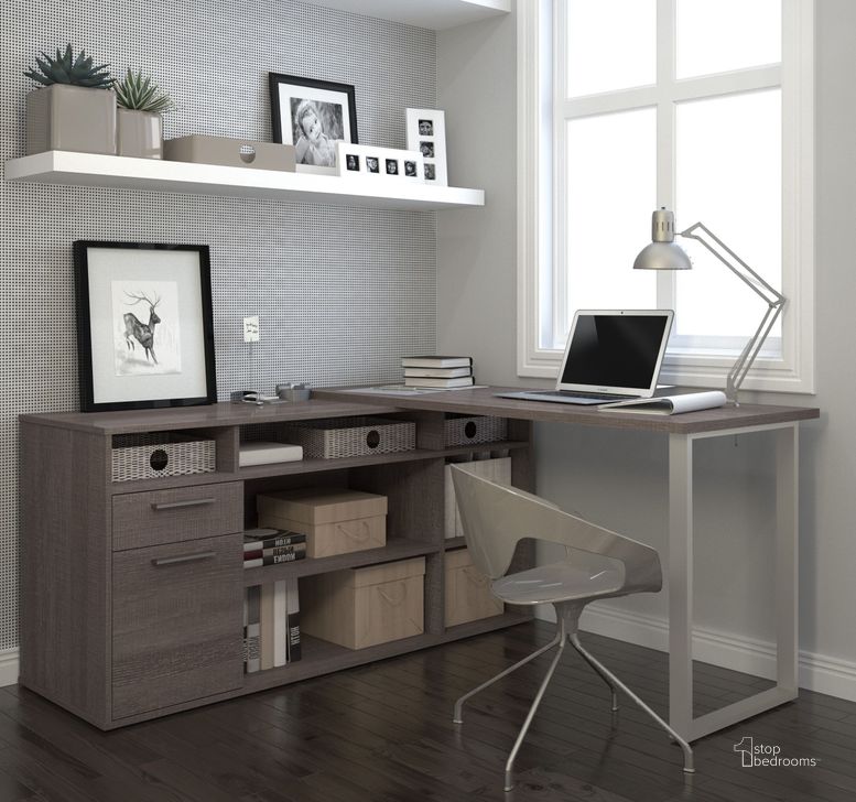 The appearance of Solay Bark Gray L Shaped Desk designed by Bestar in the modern / contemporary interior design. This gray piece of furniture  was selected by 1StopBedrooms from Solay Collection to add a touch of cosiness and style into your home. Sku: 29420-47. Material: Wood. Product Type: Desk. Image1