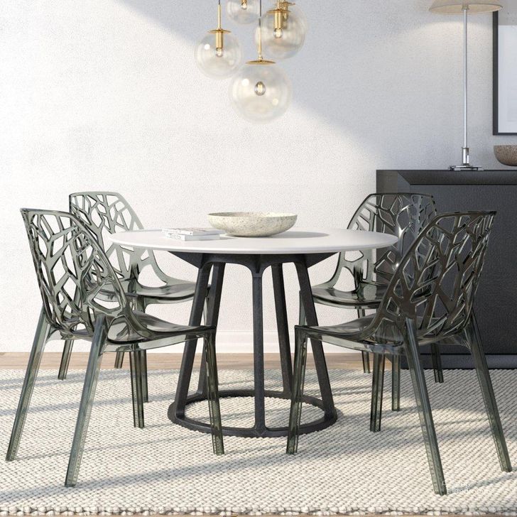 The appearance of 4 LeisureMod Cornelia Transparent Black Dining Chairs designed by LeisureMod in the modern / contemporary interior design. This transparent black piece of furniture  was selected by 1StopBedrooms from Cornelia Collection to add a touch of cosiness and style into your home. Sku: C18TBL4. Product Type: Dining Chair. Material: Plastic. Image1