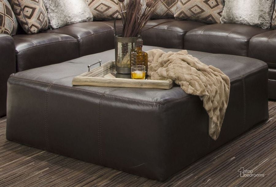 The appearance of Denali Chocolate Cocktail 40" Ottoman designed by Jackson in the transitional interior design. This brown piece of furniture  was selected by 1StopBedrooms from Denali Collection to add a touch of cosiness and style into your home. Sku: 4378121283930839. Product Type: Ottoman. Material: Vinyl. Image1